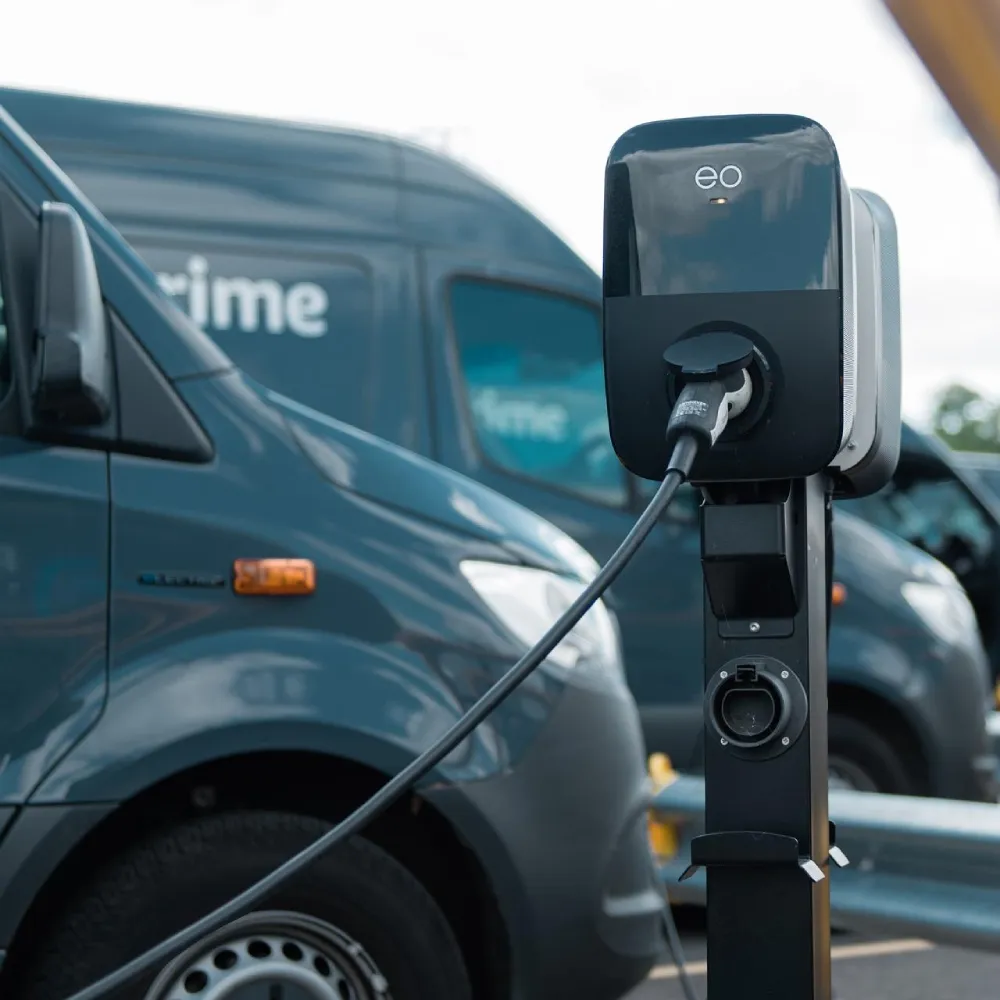 EO Genius 2 electric vehicle charger beside a delivery van