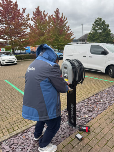Engineer working on an EV charging point at Alexandra House