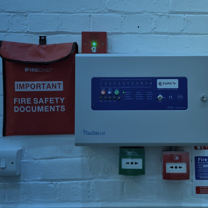 Fire alarm control panel and fire safety document pouch