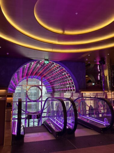 Circular ceiling lighting above the Moxy hotel reception area