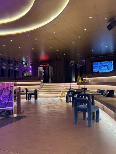 Reception counter and recessed ceiling lights at Moxy London Piccadilly Circus
