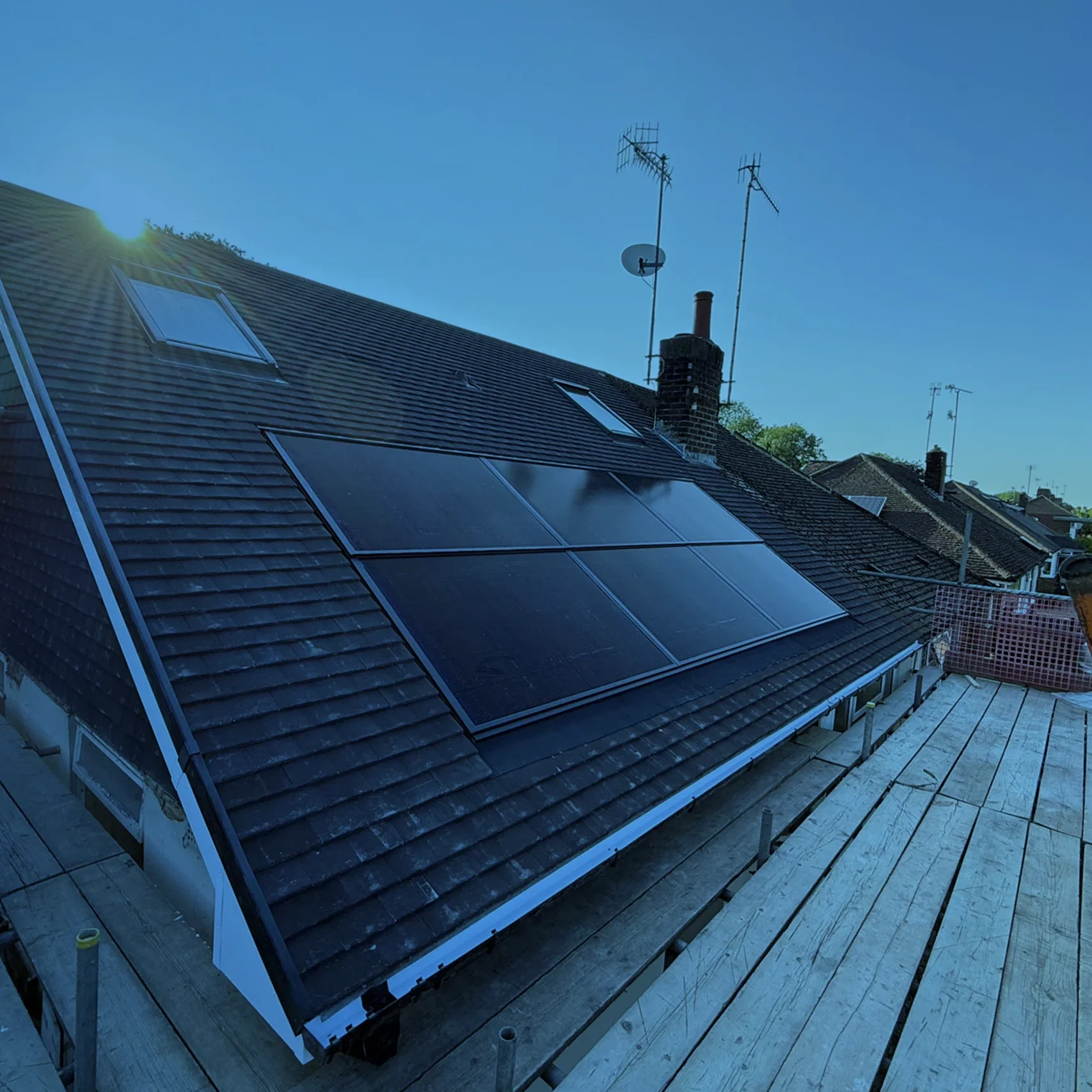 Solar panels installed across a pitched house roof