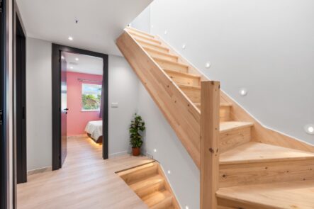 Timber staircase and recessed ceiling lighting at 6 Peters Avenue