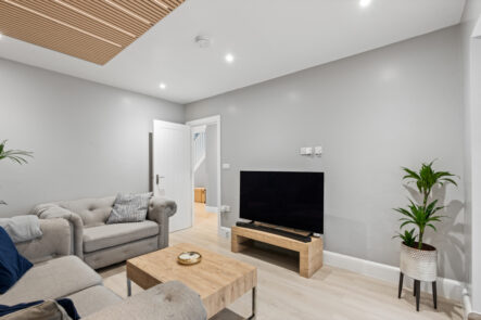 Living-room television wall and ceiling downlights at 57 St Marys Drive