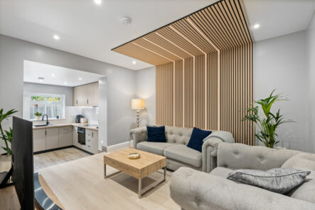 Living room with timber slat feature ceiling at 57 St Marys Drive